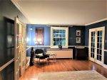 living room with dark colors and cramped space"