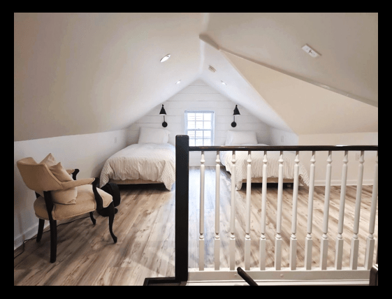 newly renovated attic with twin beds and great lighting